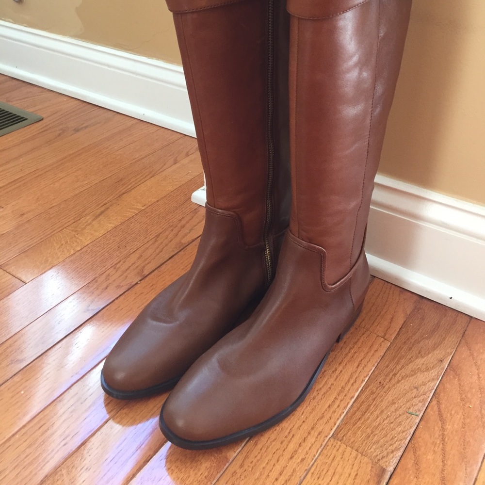 new knee high leather boots. Size 10. Never worn
